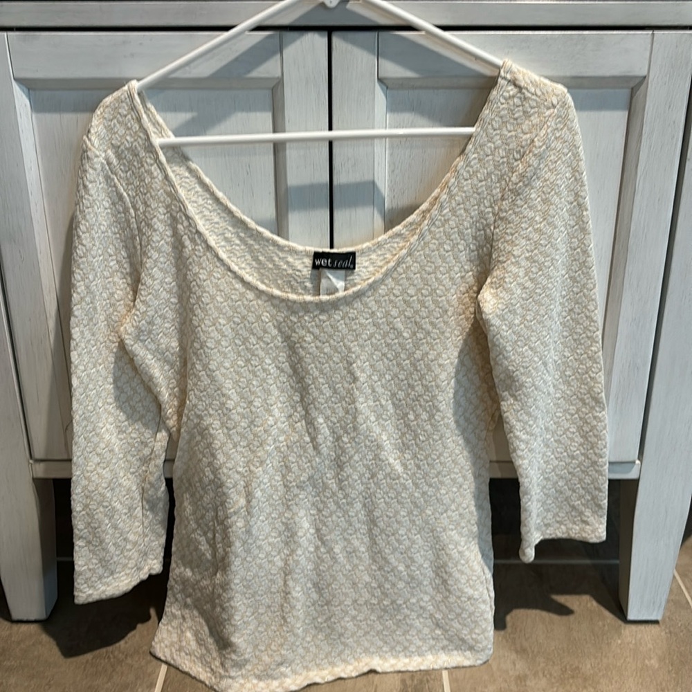 Woman’s ivory/ gold thread shirt with round neck shirt. 3/4 length sleeves.